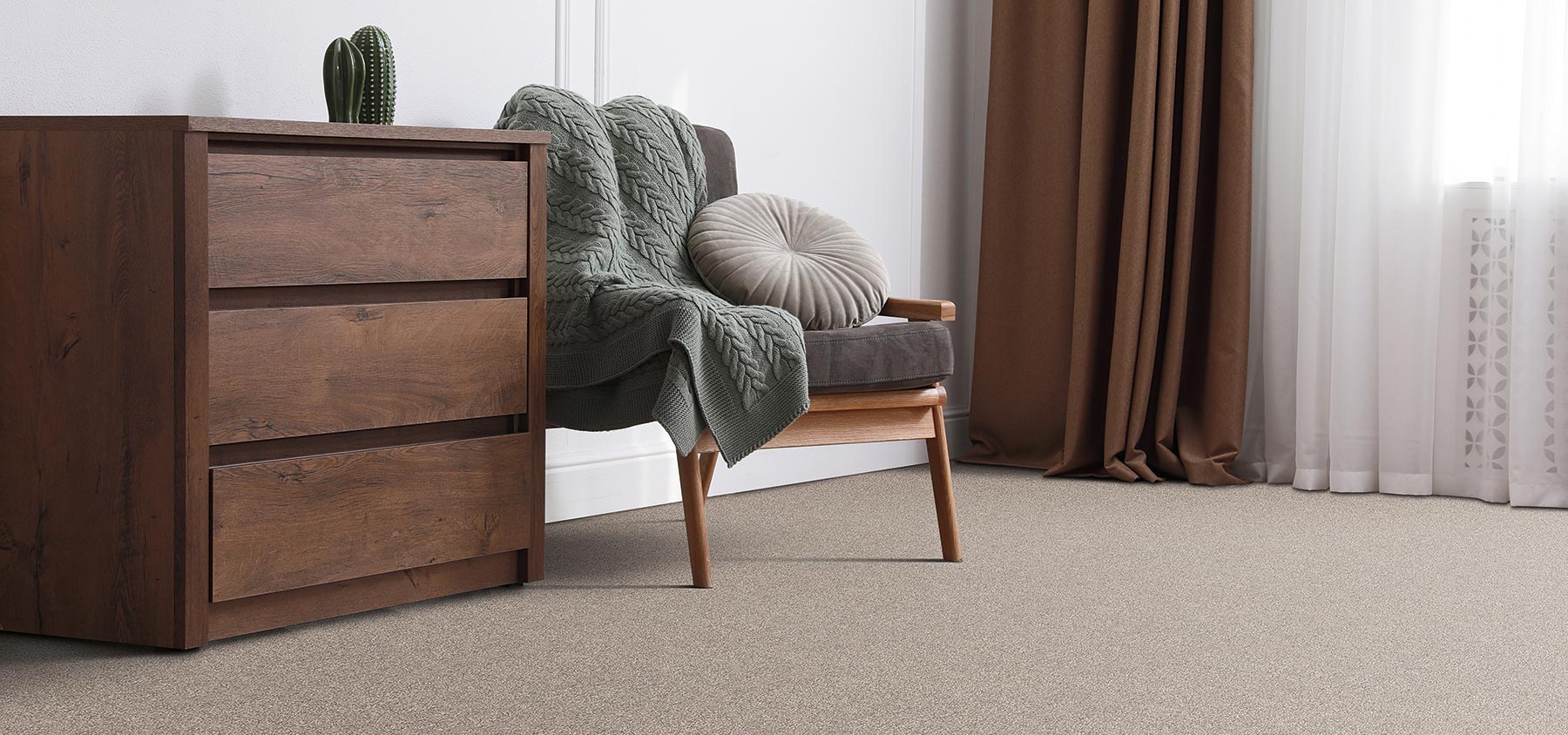 chair and nightstand in bedroom with carpet flooring