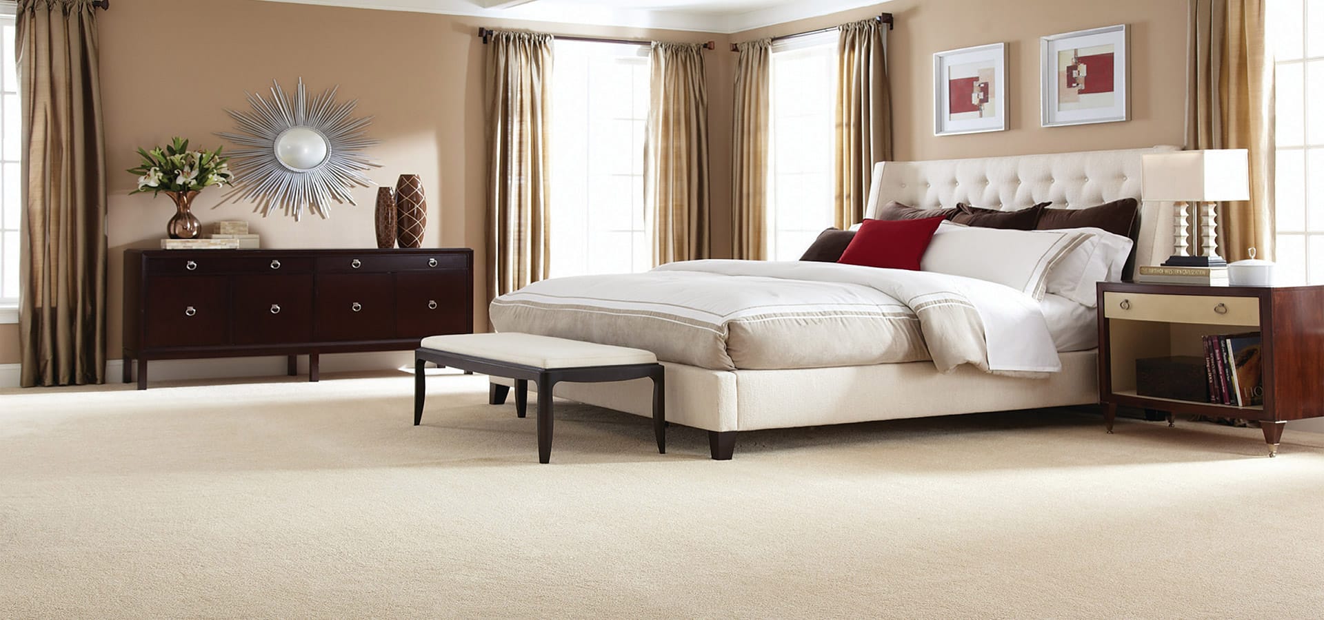 bedroom with tan carpet flooring