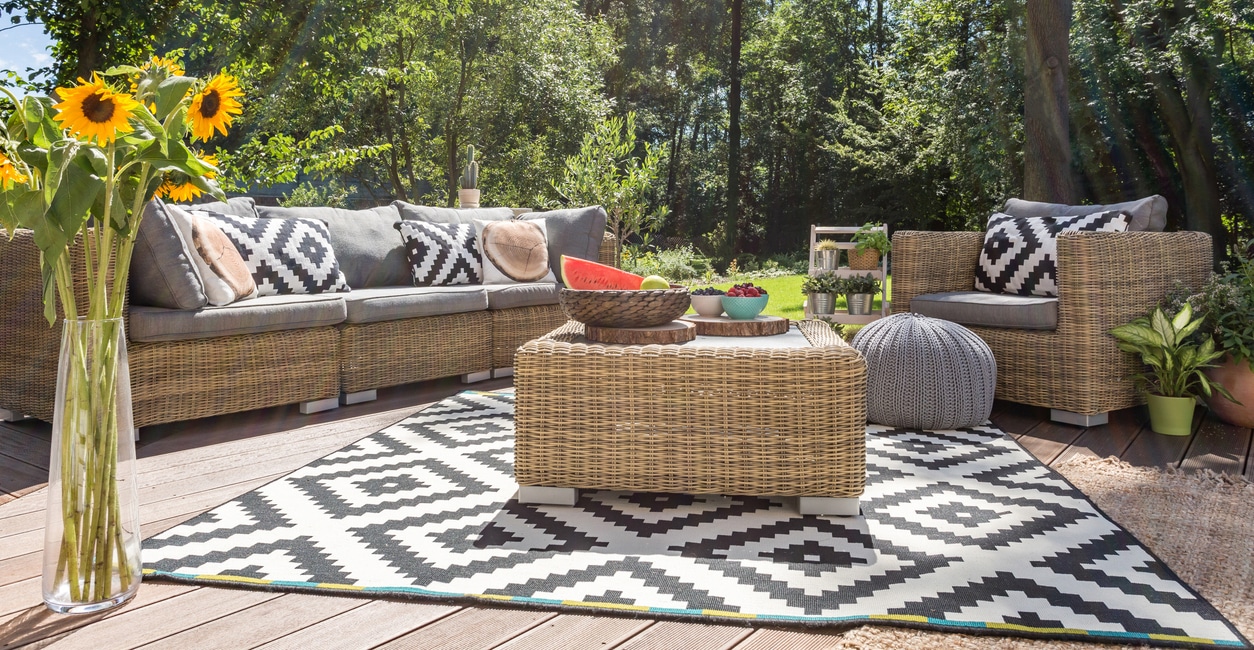Outdoor living room with matching rug and cushions