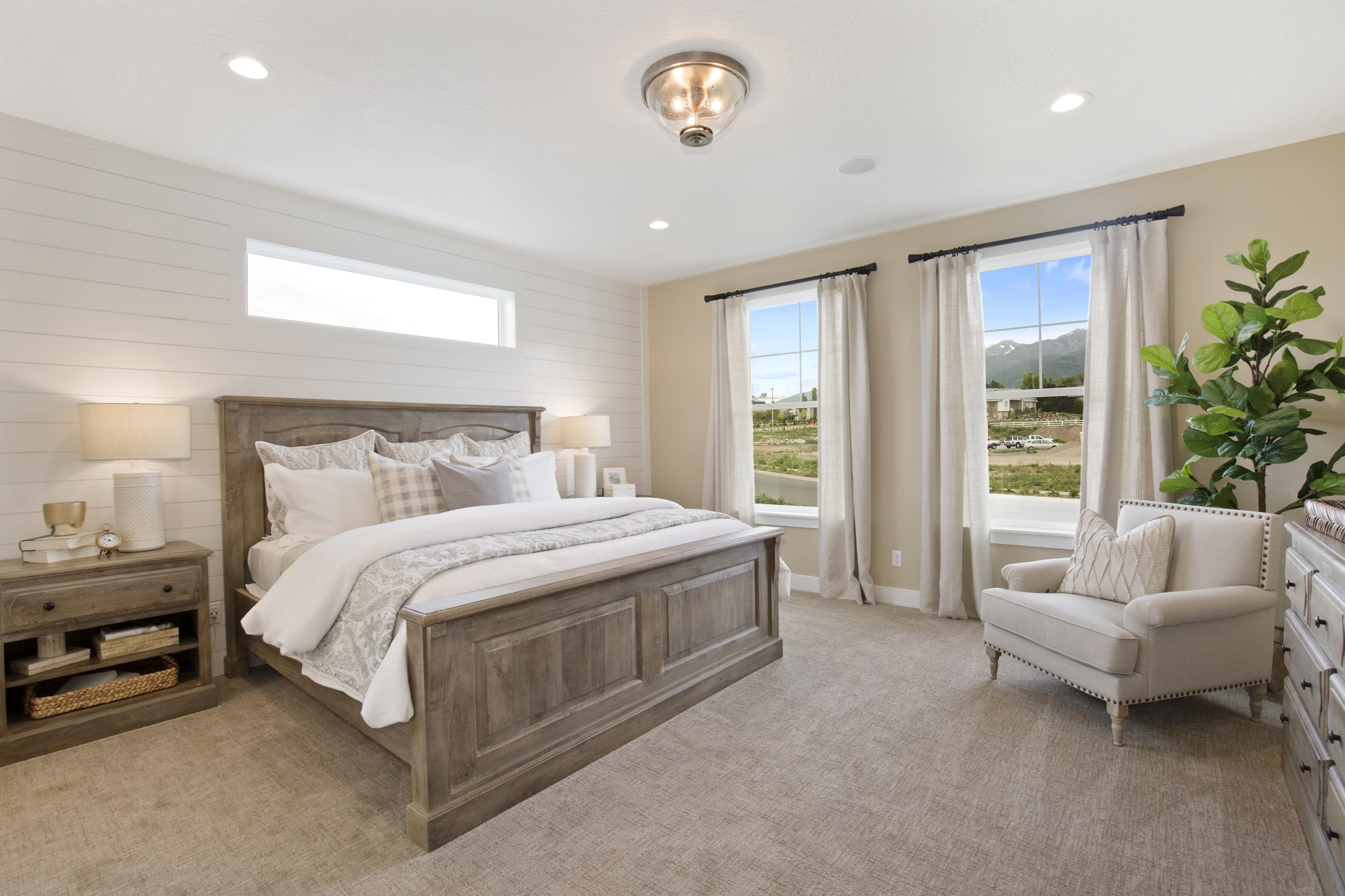 Bedroom with neutral-colored carpet