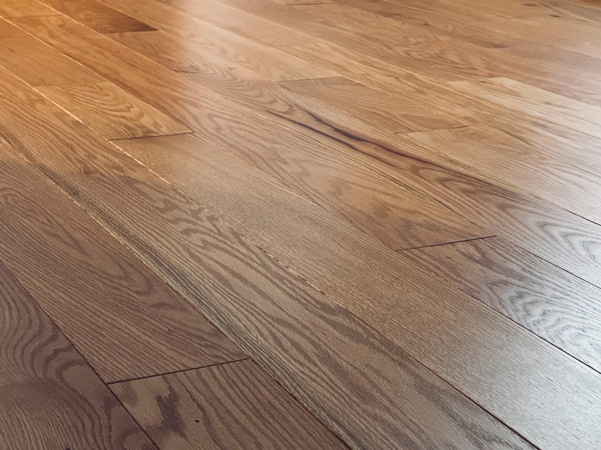 Newly installed brown engineered hardwood floor