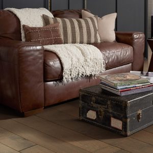 living room with brown hardwood flooring